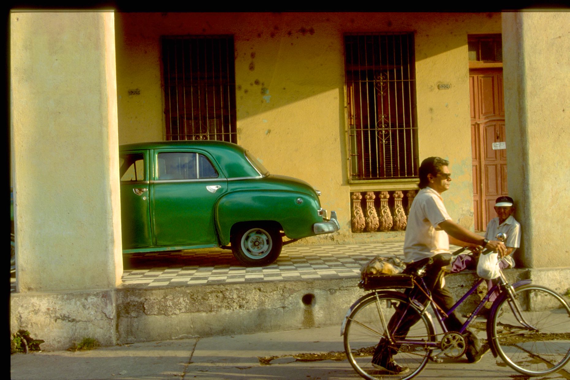 Cuba man car bike-55